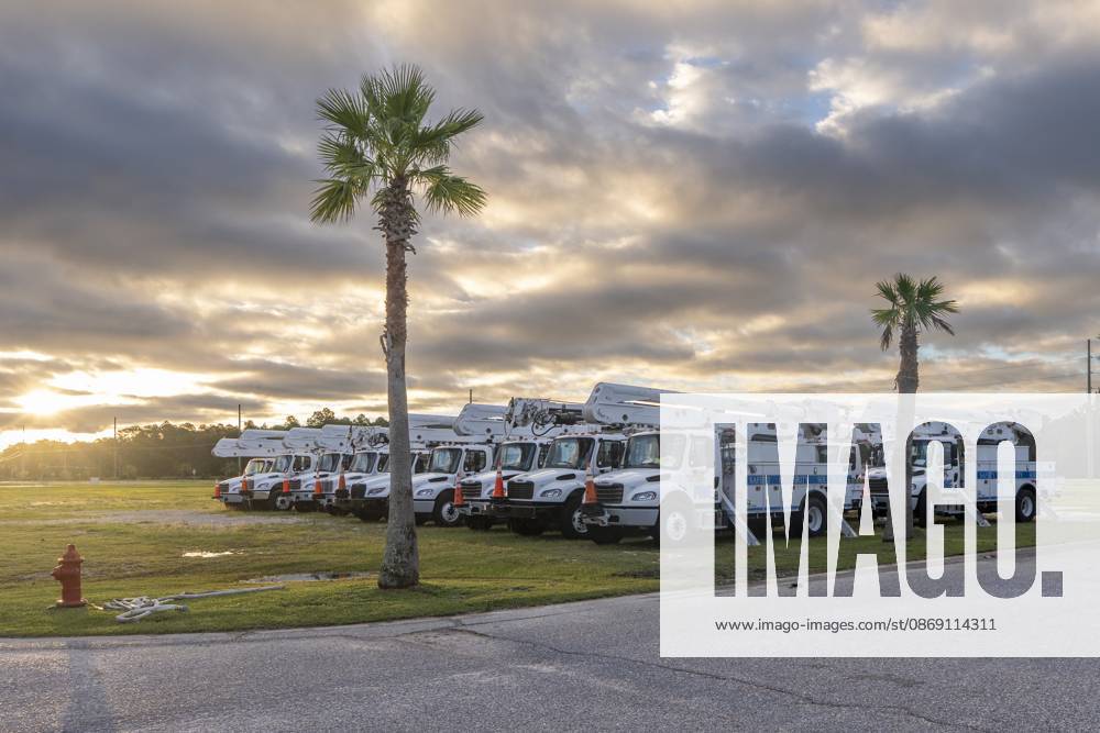 Utility trucks are staged for repairs in the aftermath of Hurricane Isaias as dawn breaks over the Gulf Coast..Hurricane Isaias made landfall Friday night. Orange Beach USA - ZUMAs197 20261010_aaa_s197_001