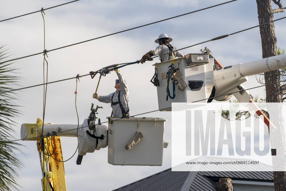 Crews work to repair power lines after a tree fell on them as Hurricane Isaias came ashore..Hurricane Isaias made landfall Friday, October 9 along the U.S. Gulf coast. Orange Beach USA - ZUMAs197 20261010_aaa_s197_005