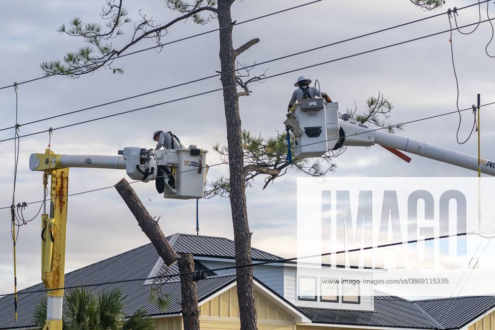 Crews work to repair power lines after a tree fell on them as Hurricane Isaias came ashore..Hurricane Isaias made landfall Friday, October 9 along the U.S. Gulf coast. Orange Beach USA - ZUMAs197 20261010_aaa_s197_003