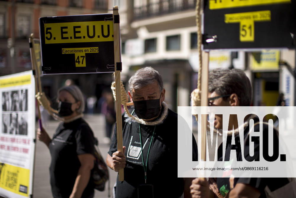 Protesters with signs and nooses around their necks during a rally at Callao Square in central Madrid. World Day Against the Death Penalty has been observed every October 10th since 2003. Madrid Spain - ZUMAs296 20261010_znp_s296_004