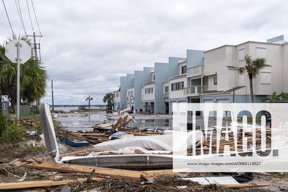 People clean up damage to their homes after Hurricane Isaias came ashore..Hurricane Isaias made landfall Friday, October 9 along the U.S. Gulf coast. Pensacola Beach USA - ZUMAs197 20261010_aaa_s197_038