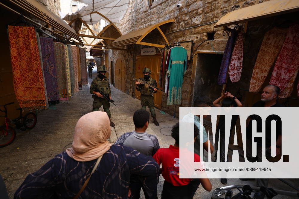Jewish Settlers Enter Hebron s Old City Under Israeli Army Protection Jewish settlers enter the Old City of Hebron in the West Bank under the protection of Israeli army forces, on October 10, 2026. Photo by Mamoun Wazwaz apaimages Hebron West Bank Palestinian Territory 101026_Hebron_MW_00(13)