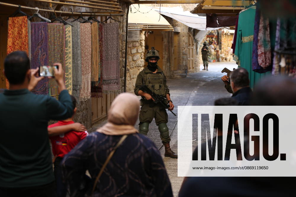 Jewish Settlers Enter Hebron s Old City Under Israeli Army Protection Jewish settlers enter the Old City of Hebron in the West Bank under the protection of Israeli army forces, on October 10, 2026. Photo by Mamoun Wazwaz apaimages Hebron West Bank Palestinian Territory 101026_Hebron_MW_00(18)