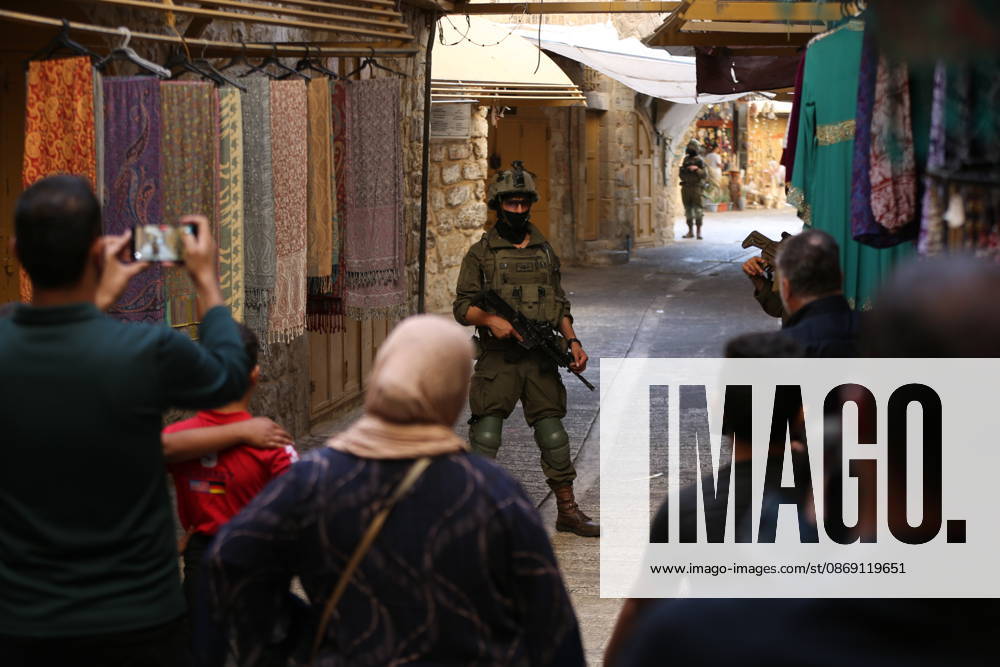 Jewish Settlers Enter Hebron s Old City Under Israeli Army Protection Jewish settlers enter the Old City of Hebron in the West Bank under the protection of Israeli army forces, on October 10, 2026. Photo by Mamoun Wazwaz apaimages Hebron West Bank Palestinian Territory 101026_Hebron_MW_00(19)