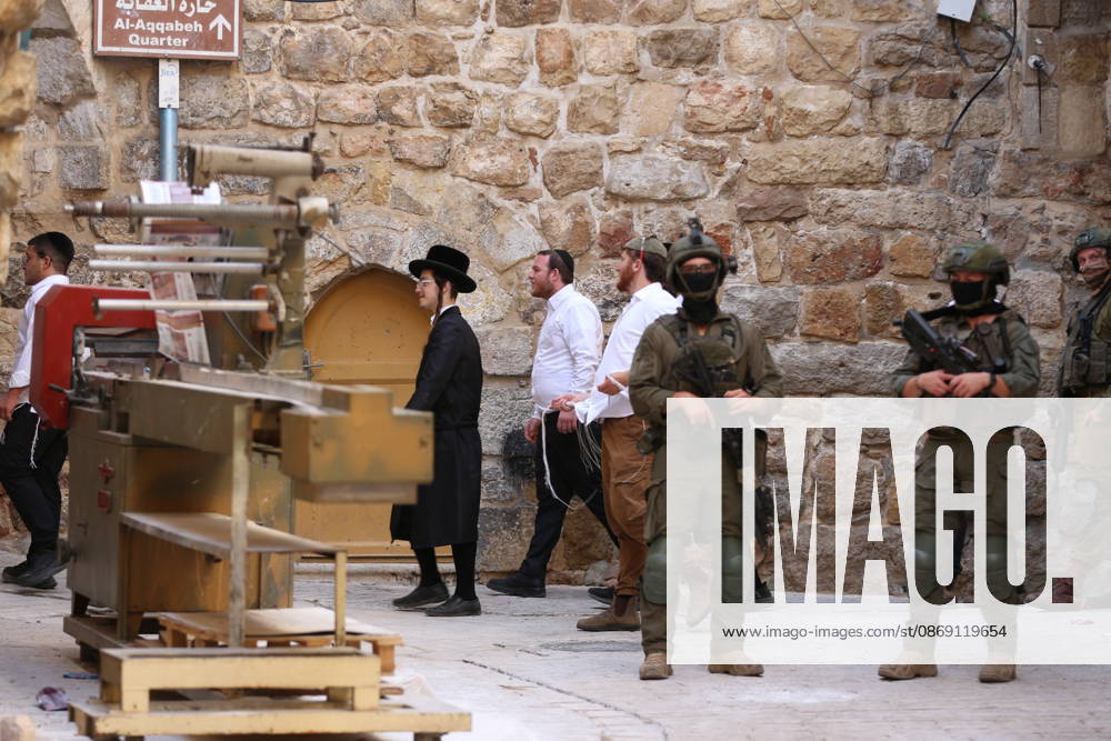 Jewish Settlers Enter Hebron s Old City Under Israeli Army Protection Jewish settlers enter the Old City of Hebron in the West Bank under the protection of Israeli army forces, on October 10, 2026. Photo by Mamoun Wazwaz apaimages Hebron West Bank Palestinian Territory 101026_Hebron_MW_00(21)