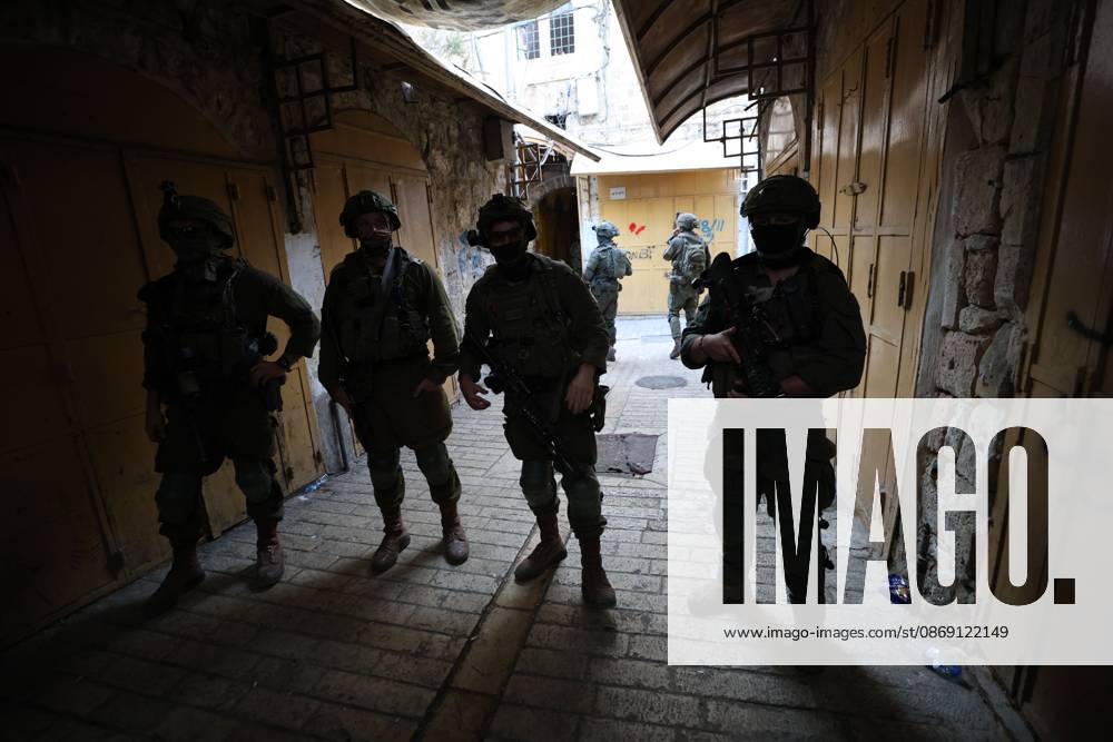 Israeli settlers enter Hebron Old City under military protection HEBRON, OCCUPIED WEST BANK, OCTOBER 10, 2026: Israeli settlers enter Hebron s Old City under the protection of Israeli forces during an organized visit to the area. Israeli soldiers deployed along streets and around the group as settlers moved through the Old City, where Israeli settlers and Palestinian residents live in close proximity amid longstanding tensions and movement restrictions. HEBRON Palestine, State of