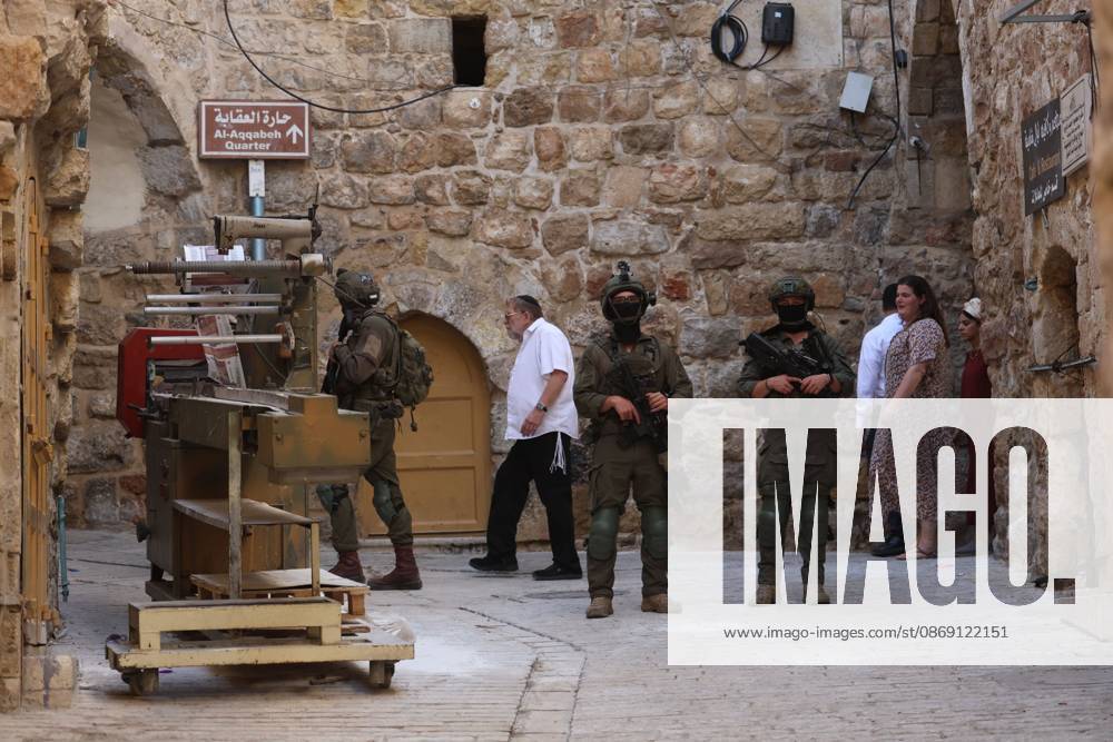 Israeli settlers enter Hebron Old City under military protection HEBRON, OCCUPIED WEST BANK, OCTOBER 10, 2026: Israeli settlers enter Hebron s Old City under the protection of Israeli forces during an organized visit to the area. Israeli soldiers deployed along streets and around the group as settlers moved through the Old City, where Israeli settlers and Palestinian residents live in close proximity amid longstanding tensions and movement restrictions. HEBRON Palestine, State of