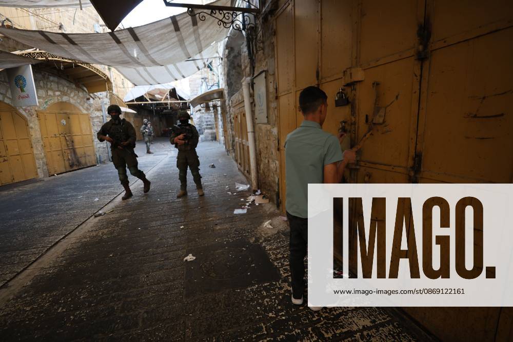 Israeli settlers enter Hebron Old City under military protection HEBRON, OCCUPIED WEST BANK, OCTOBER 10, 2026: Israeli settlers enter Hebron s Old City under the protection of Israeli forces during an organized visit to the area. Israeli soldiers deployed along streets and around the group as settlers moved through the Old City, where Israeli settlers and Palestinian residents live in close proximity amid longstanding tensions and movement restrictions. HEBRON Palestine, State of