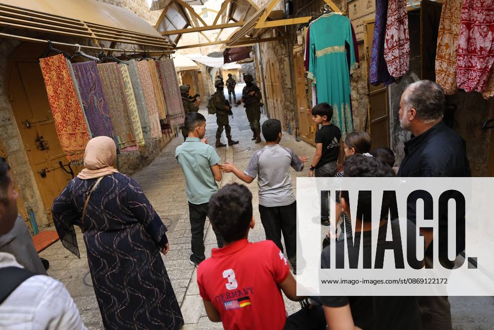 Israeli settlers enter Hebron Old City under military protection HEBRON, OCCUPIED WEST BANK, OCTOBER 10, 2026: Israeli settlers enter Hebron s Old City under the protection of Israeli forces during an organized visit to the area. Israeli soldiers deployed along streets and around the group as settlers moved through the Old City, where Israeli settlers and Palestinian residents live in close proximity amid longstanding tensions and movement restrictions. HEBRON Palestine, State of