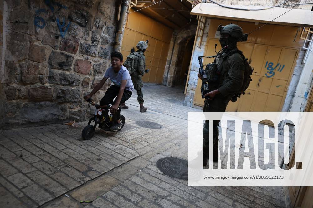 Israeli settlers enter Hebron Old City under military protection HEBRON, OCCUPIED WEST BANK, OCTOBER 10, 2026: Israeli settlers enter Hebron s Old City under the protection of Israeli forces during an organized visit to the area. Israeli soldiers deployed along streets and around the group as settlers moved through the Old City, where Israeli settlers and Palestinian residents live in close proximity amid longstanding tensions and movement restrictions. HEBRON Palestine, State of