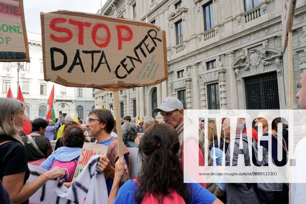 Protesters demand moratorium on new data centers in Milan MILAN, ITALY OCTOBER 10, 2026: Protesters gather for a sit-in in Piazza della Scala in central Milan to oppose the development of new data centers across Lombardy and Italy. The demonstration is organized by the Rete dei Comitati No Data Center (No Data Center Committee Network), which is calling for a moratorium on permits for new facilities. The group also urges public authorities to conduct thorough environmental, urban planning and regional assessments before approving projects. For approved facilities that have not yet begun operating, campaigners are calling for reviews to be reopened if potential microclimate effects and cumulative impacts with existing facilities were not