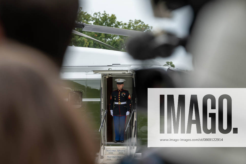 A U.S. Marine stands in the doorway of Marine One on the South Lawn of the White House ahead of President DONALD TRUMPâ€⠢s departure for Clarksville, Tennessee, where he is scheduled to attend a campaign rally. Washington United States - ZUMAk206 20261010_znp_k206_011