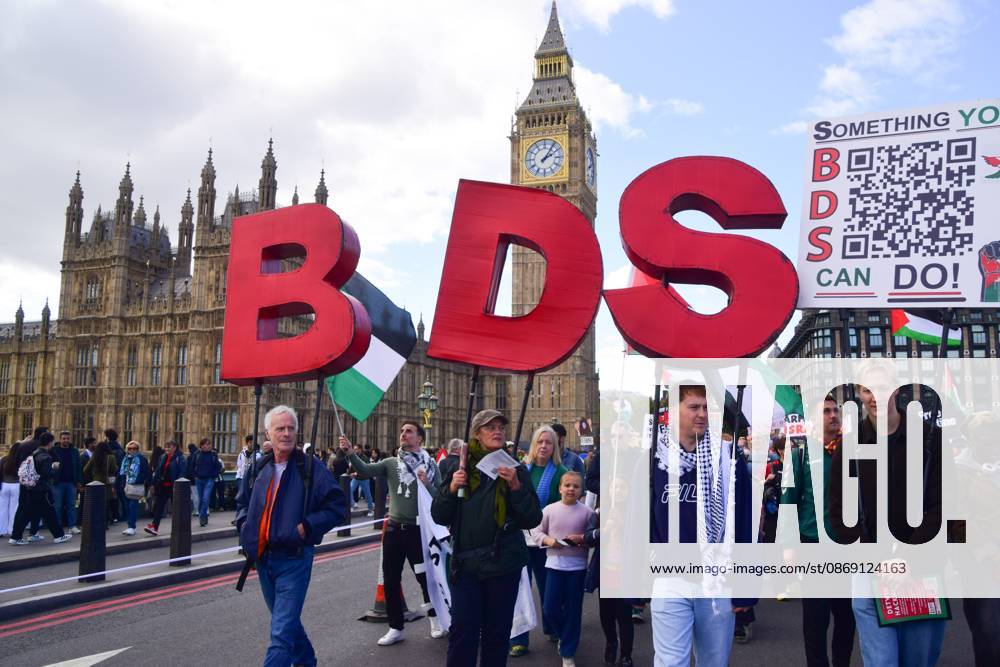 Protesters hold large BDS letters (Boycott, Divestment, Sanctions) on Westminster Bridge during the National March for Palestine..Thousands of people marched in Central London marking three years of what the protest organisers call the genocide against the Palestinian people in Gaza London United Kingdom - ZUMAs197 20261010_aaa_s197_181