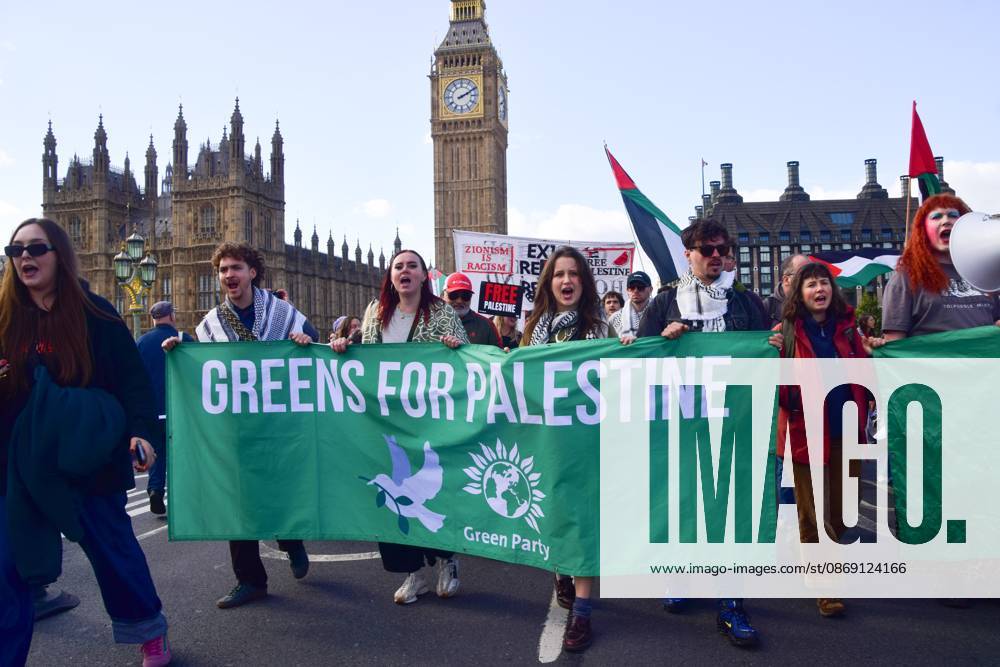 Green Party protesters hold a Greens For Palestine banner on Westminster Bridge during the National March for Palestine..Thousands of people marched in Central London marking three years of what the protest organisers call the genocide against the Palestinian people in Gaza London United Kingdom - ZUMAs197 20261010_aaa_s197_184
