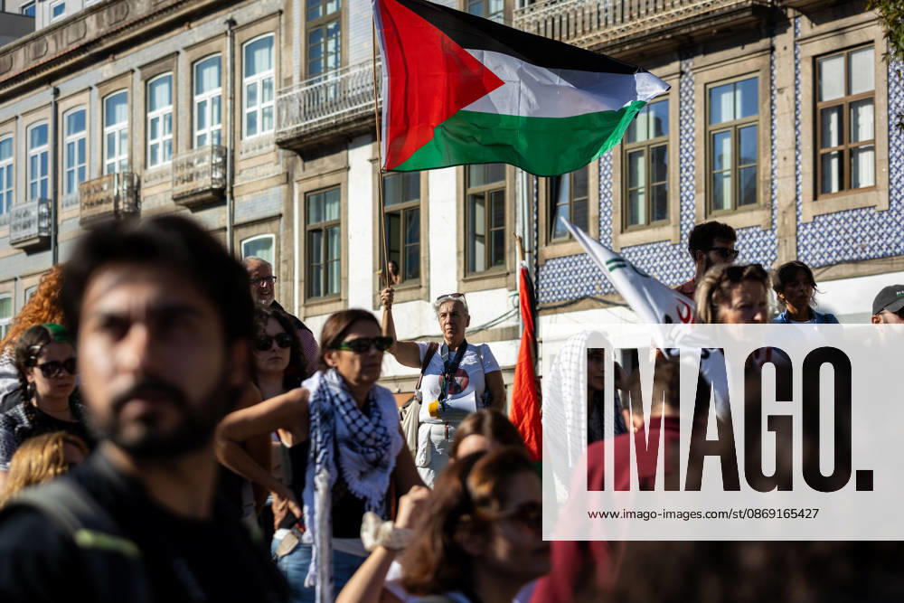 Palestine Solidarity March in Porto - 10 Oct 2026 Participants hold Palestinian flags during a global day of action for Palestine. Hundreds of demonstrators gathered in Porto for a Palestine solidarity march calling for an end to the war in Gaza and support for Palestinian rights. The march began at Praça dos Poveiros and concluded at Praça D. João I. Porto Portugal