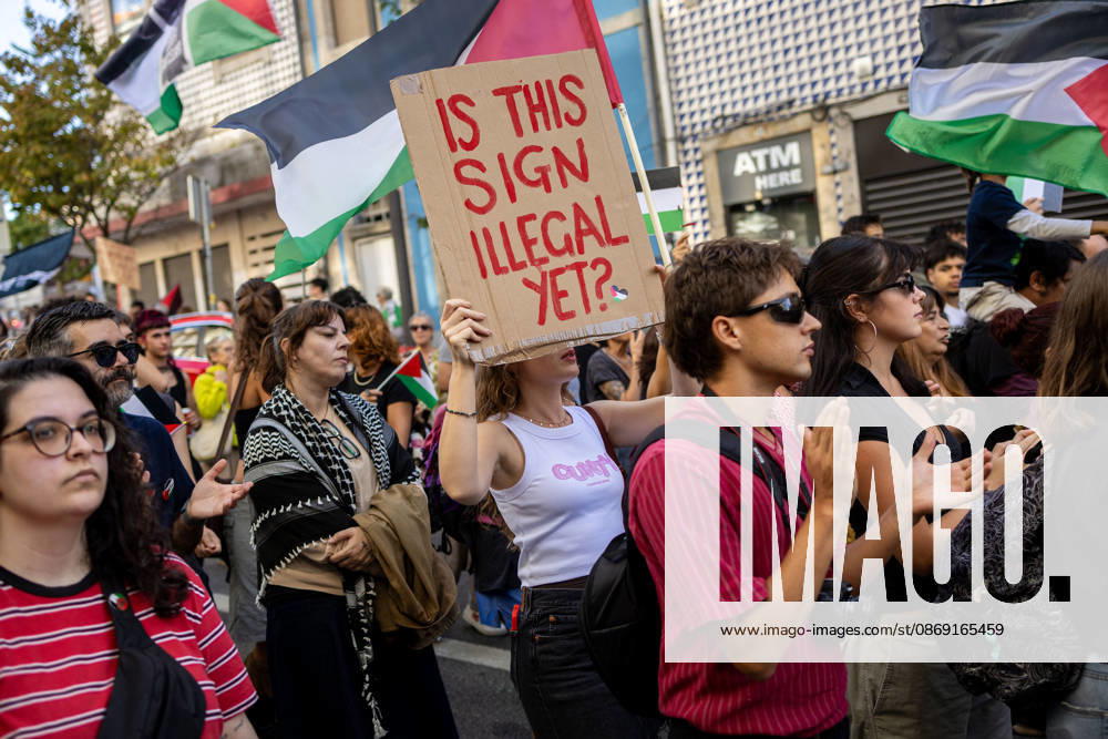 Palestine Solidarity March in Porto - 10 Oct 2026 Demonstrators march through central Porto carrying Palestinian flags during a Palestine solidarity demonstration. Hundreds of demonstrators gathered in Porto for a Palestine solidarity march calling for an end to the war in Gaza and support for Palestinian rights. The march began at Praça dos Poveiros and concluded at Praça D. João I. Porto Portugal