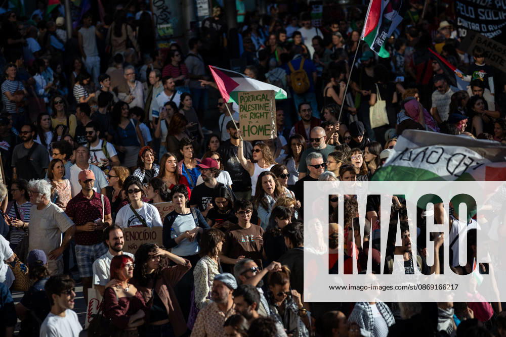 Participants with Palestinian flags and placards gather at Praca D. Joao I at the end of a Palestine solidarity march. Hundreds of demonstrators gathered in Porto for a Palestine solidarity march calling for an end to the war in Gaza and support for Palestinian rights. The march began at Praca dos Poveiros and concluded at Praca D. Joao I. Porto Portugal - ZUMAs197 20261010_aaa_s197_445