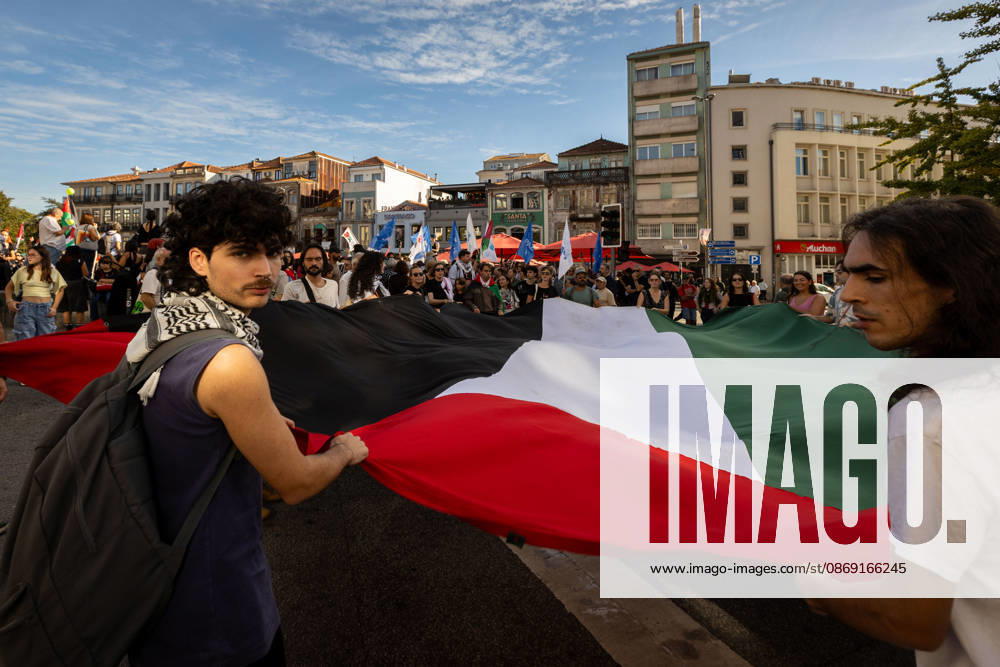 Participants carry a large Palestinian flag at the start of a Palestine solidarity march. Hundreds of demonstrators gathered in Porto for a Palestine solidarity march calling for an end to the war in Gaza and support for Palestinian rights. The march began at Praca dos Poveiros and concluded at Praca D. Joao I. Porto Portugal - ZUMAs197 20261010_aaa_s197_454