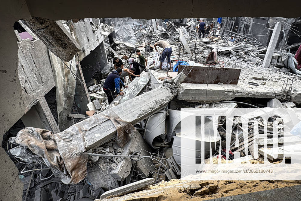 Palestinians Inspect Damage After Strike in Deir al-Balah Palestinians inspect their belongings amid the rubble of damaged residential buildings and their displacement tents after an Israeli airstrike targeted a house in Deir al-Balah, in the central Gaza Strip, on October 11, 2026. Photo by Ahmed Ibrahim apaimages Deir al-Balah Gaza Palestinian Territory 111026_Deir_al-Balah_AI_00(13)