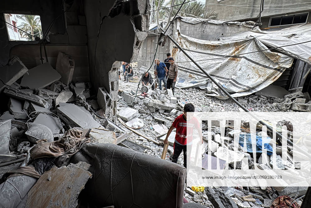 Palestinians Inspect Damage After Strike in Deir al-Balah Palestinians inspect their belongings amid the rubble of damaged residential buildings and their displacement tents after an Israeli airstrike targeted a house in Deir al-Balah, in the central Gaza Strip, on October 11, 2026. Photo by Ahmed Ibrahim apaimages Deir al-Balah Gaza Palestinian Territory 111026_Deir_al-Balah_AI_00(16)