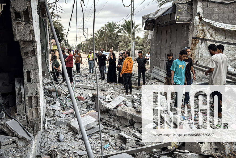 Palestinians Inspect Damage After Strike in Deir al-Balah Palestinians inspect their belongings amid the rubble of damaged residential buildings and their displacement tents after an Israeli airstrike targeted a house in Deir al-Balah, in the central Gaza Strip, on October 11, 2026. Photo by Ahmed Ibrahim apaimages Deir al-Balah Gaza Palestinian Territory 111026_Deir_al-Balah_AI_00(2)