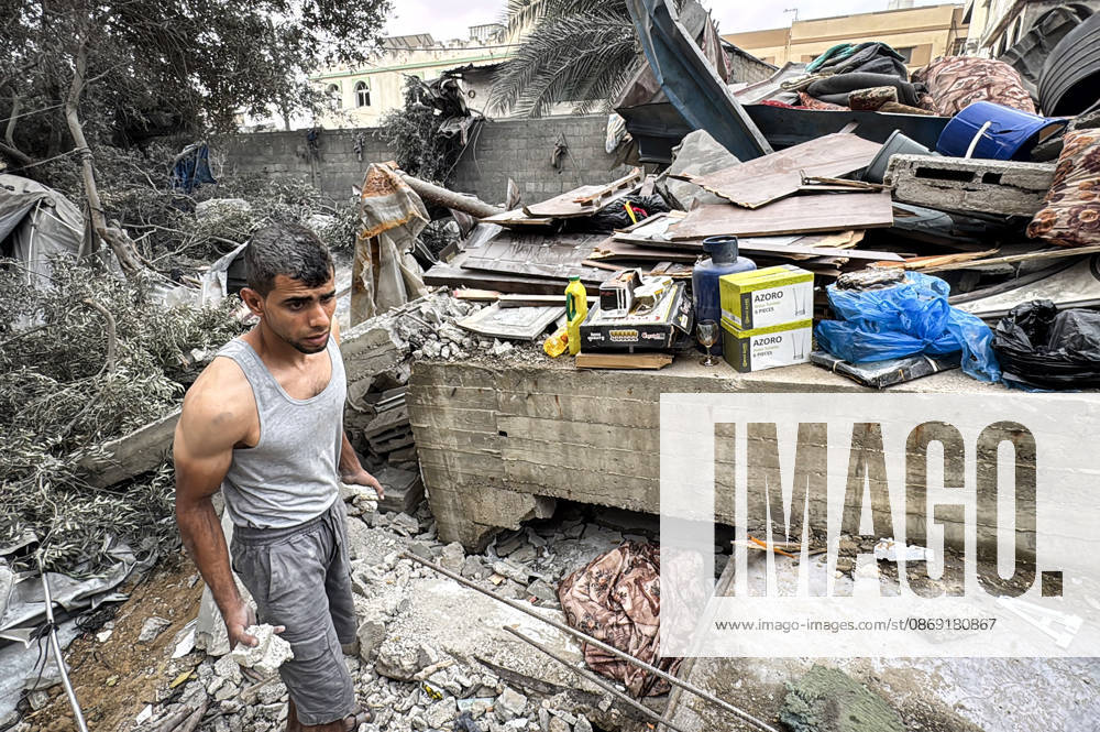 Palestinians Inspect Damage After Strike in Deir al-Balah Palestinians inspect their belongings amid the rubble of damaged residential buildings and their displacement tents after an Israeli airstrike targeted a house in Deir al-Balah, in the central Gaza Strip, on October 11, 2026. Photo by Ahmed Ibrahim apaimages Deir al-Balah Gaza Palestinian Territory 111026_Deir_al-Balah_AI_00(24)