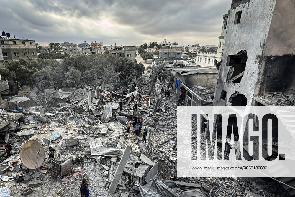Palestinians Inspect Damage After Strike in Deir al-Balah Palestinians inspect their belongings amid the rubble of damaged residential buildings and their displacement tents after an Israeli airstrike targeted a house in Deir al-Balah, in the central Gaza Strip, on October 11, 2026. Photo by Ahmed Ibrahim apaimages Deir al-Balah Gaza Palestinian Territory 111026_Deir_al-Balah_AI_00(5)