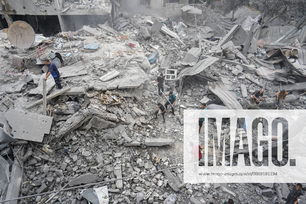 Israeli attack on Az-Zawayda area in Gaza DEIR AL-BALAH, GAZA, PALESTINE - OCTOBER 11: People search through the rubble of a building belonging to the Buheysi family following an Israeli airstrike in the town of Az-Zawayda, near Deir al-Balah in the central Gaza Strip, on October 11, 2026. Israeli forces carried out the strike despite the ceasefire, destroying the building and damaging surrounding structures. Adam Bilal Anadolu Deir Al-Balah Gaza. Editorial use only. Please get in touch for any other usage.