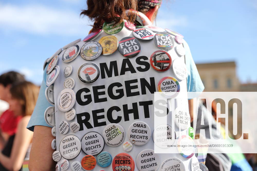 A protester stands in the Old Market Square wearing a Grandmas Against the Right pin during a demonstration calling for the Federal Constitutional Court to review far-right parties, Potsdam, October 10, 2026. Protest in Potsdam