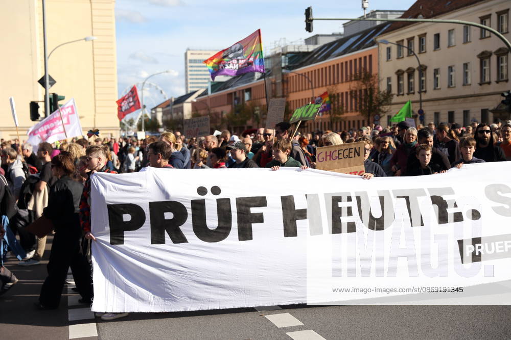 Protesters stand on Breite Straße holding a banner reading Review Today, Ban Tomorrow during a demonstration calling for the Federal Constitutional Court to review far-right parties, Potsdam, October 10, 2026. Review Demonstration in Potsdam