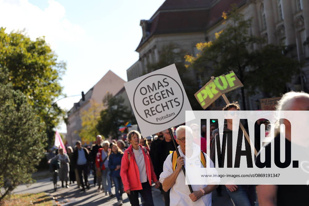 A protester walks down Dortustraße in Potsdam carrying a sign reading Grandmas Against the Right during a demonstration calling for the Federal Constitutional Court to review far-right parties, Potsdam, October 10, 2026. Protest in Potsdam