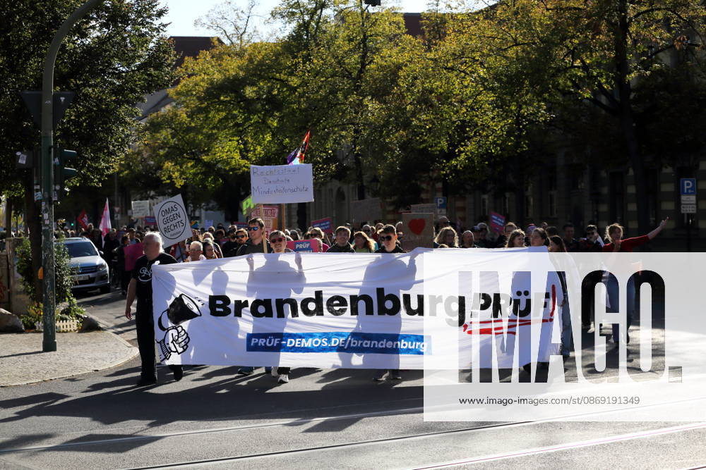 Protesters march with a banner reading Brandenburg Review on Dortustraße during a demonstration calling for the Federal Constitutional Court to review far-right parties, Potsdam, October 10, 2026 Review Demonstration in Potsdam