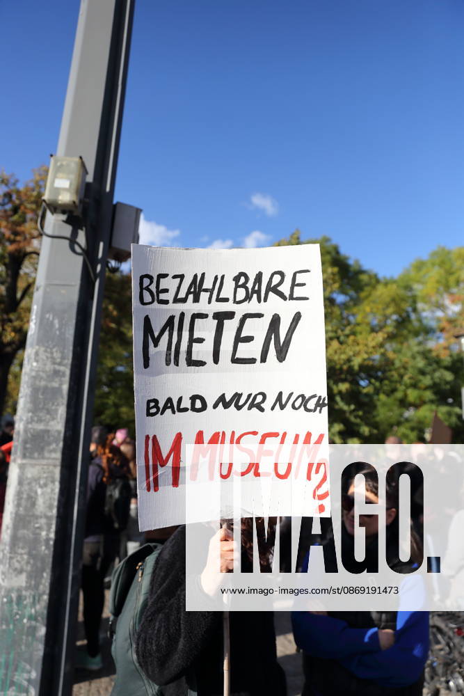 A protester stands with a sign reading Affordable Rent Soon Only in a Museum at Unity Square during a demonstration against the housing crisis and rising rents, Potsdam, October 10, 2026. Rent Protest in Potsdam