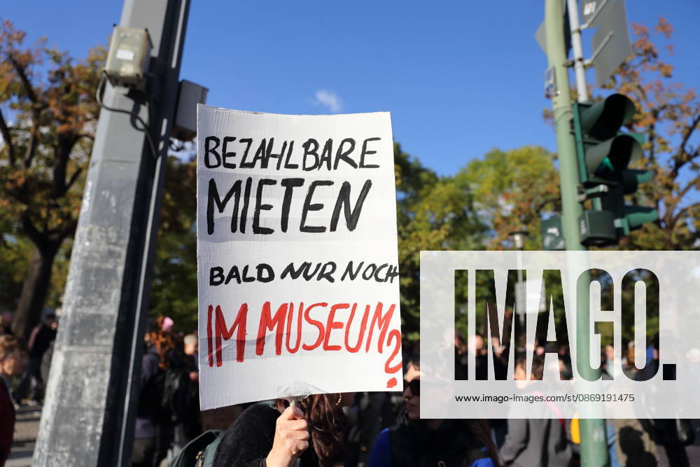 A protester stands with a sign reading Affordable Rent Soon Only in a Museum at Unity Square during a demonstration against the housing crisis and rising rents, Potsdam, October 10, 2026. Rent Protest in Potsdam