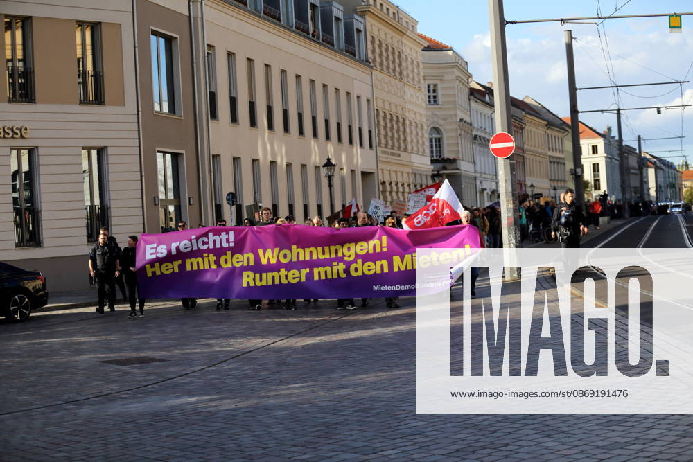 Protesters march down Friedrich-Ebert-Straße carrying a banner that reads Enough Is Enough—Give Us Apartments, Lower the Rents during a demonstration against the housing crisis and rising rents, Potsdam, October 10, 2026. Rent Protest in Potsdam