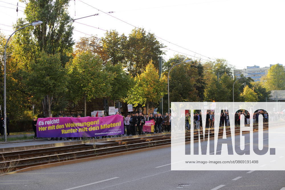 Protesters march down Rudolf Breitscheid Street carrying a banner reading Enough Is Enough—Give Us Apartments, Lower the Rents during a demonstration against the housing crisis and rising rents, Potsdam, October 10, 2026. Rent Protest in Potsdam