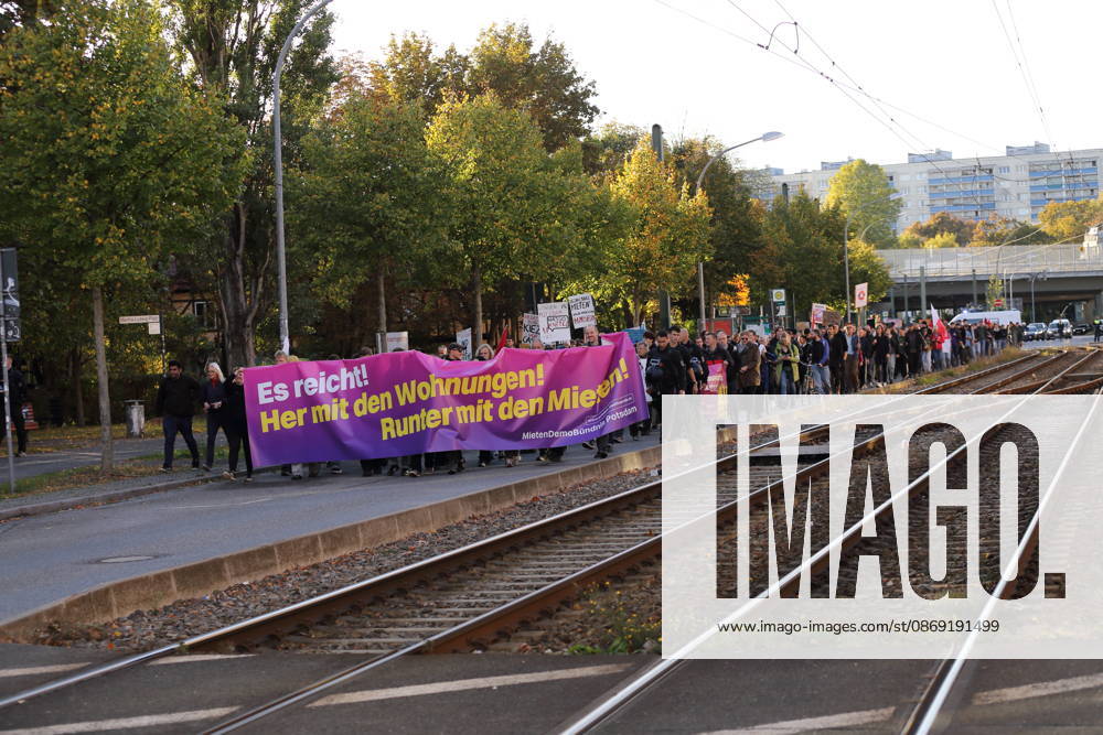 Protesters march down Rudolf Breitscheid Street carrying a banner reading Enough Is Enough—Give Us Apartments, Lower the Rents during a demonstration against the housing crisis and rising rents, Potsdam, October 10, 2026. Rent Protest in Potsdam