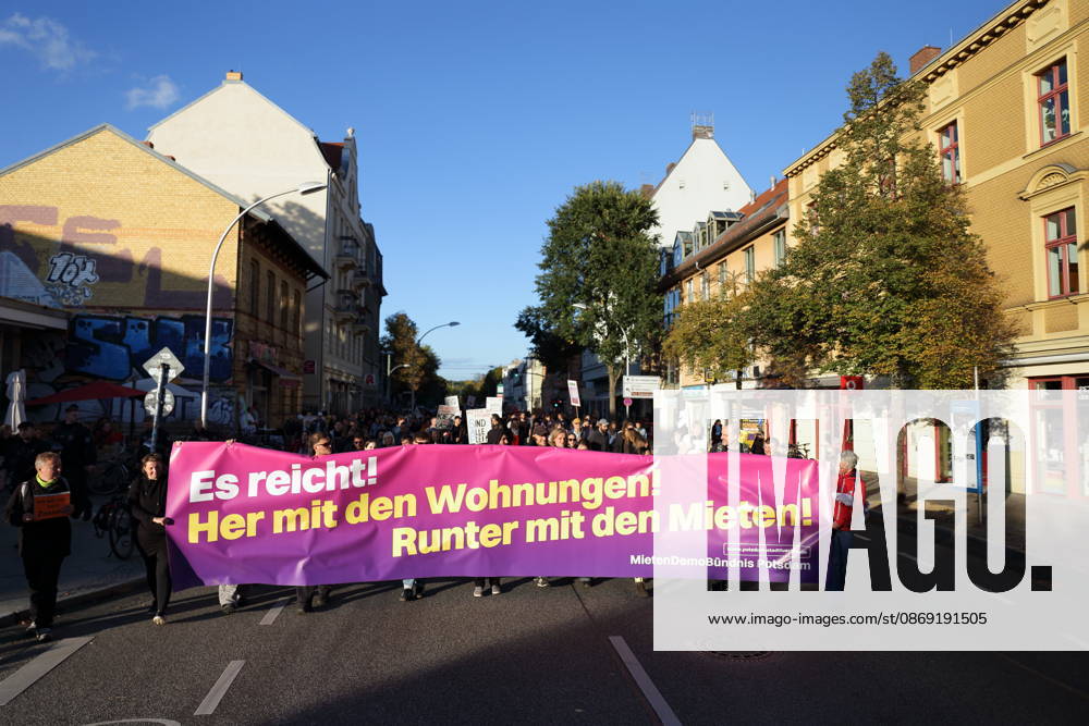 Protesters march down Karl Liebknecht Street carrying a banner reading Enough Is Enough—Give Us Housing, Lower the Rents during a demonstration against the housing crisis and rising rents, Potsdam, October 10, 2026. Rent Protest in Potsdam