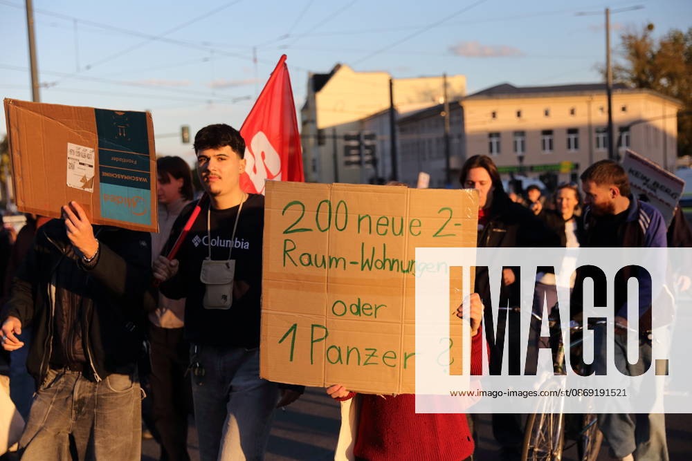 Protesters march down Friedrich Engels Street carrying a sign that reads 200 new two-room apartments or 1 tank during a demonstration against the housing crisis and rising rents, Potsdam, October 10, 2026. Rent Protest in Potsdam