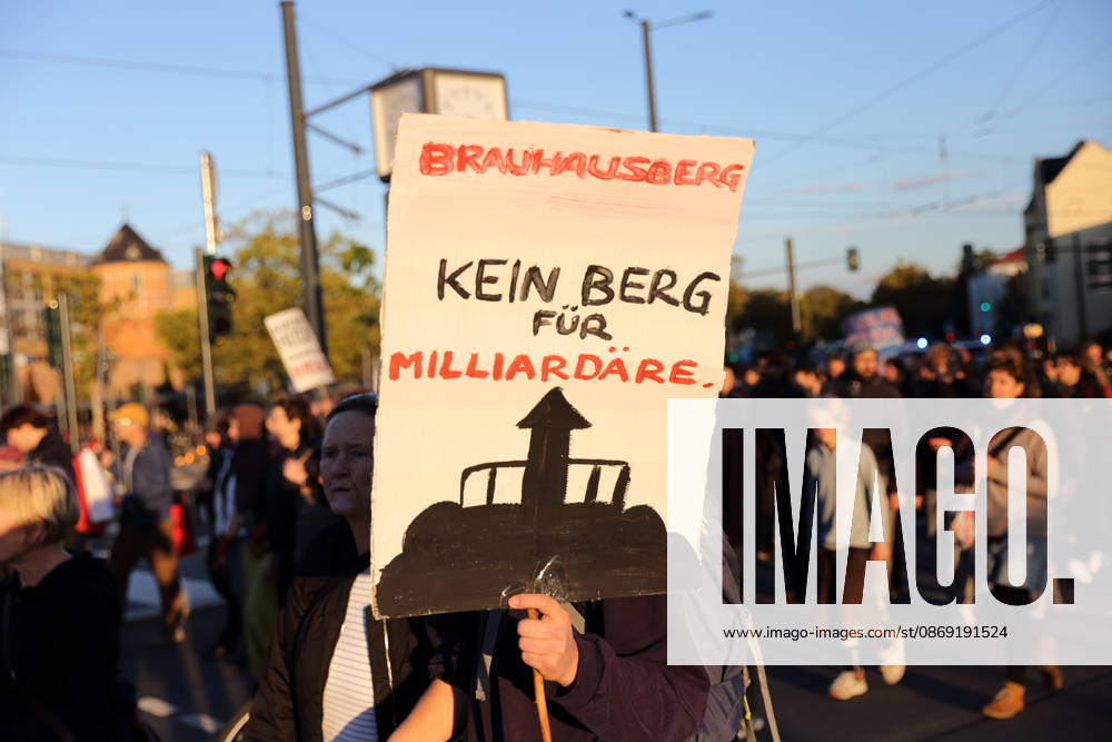 Protesters march down Friedrich Engels Street carrying a sign that reads Brauhausberg: Not a Mountain for Billionaires during a demonstration against the housing crisis and rising rents, Potsdam, October 10, 2026. Rent Protest in Potsdam