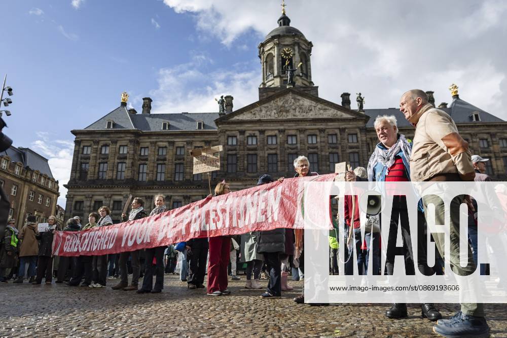 AMSTERDAM - Demonstrators during a national protest on Dam Square marking the conclusion of the nationwide week of action for sanctions against Israel. According to various activist groups, despite the ceasefire , the genocide against the Palestinian people continues unabated. KOEN VAN WEEL ANP netherlands out - belgium out