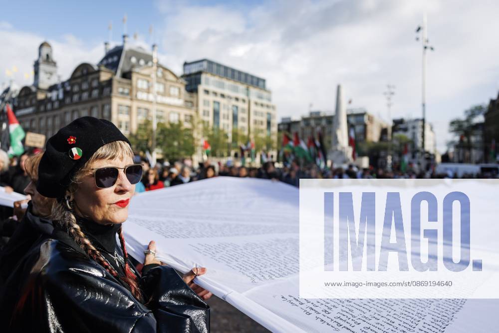 AMSTERDAM - Demonstrators during a national protest on Dam Square marking the conclusion of the nationwide week of action for sanctions against Israel. According to various activist groups, despite the ceasefire , the genocide against the Palestinian people continues unabated. KOEN VAN WEEL ANP netherlands out - belgium out