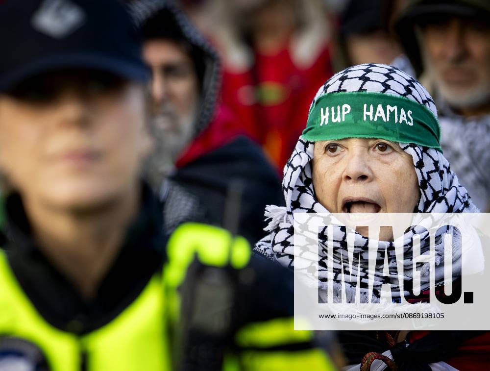 AMSTERDAM - Demonstrators during a national protest on Dam Square marking the conclusion of the nationwide week of action for sanctions against Israel. According to various activist groups, despite the ceasefire , the genocide against the Palestinian people continues unabated. KOEN VAN WEEL ANP netherlands out - belgium out