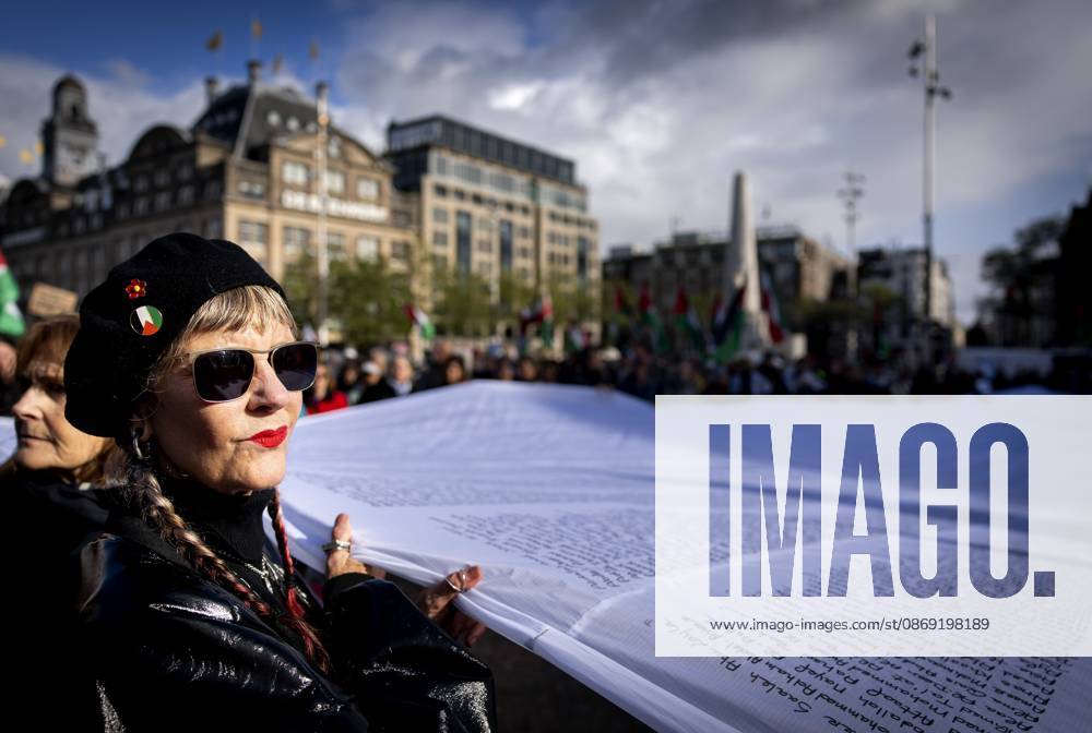 AMSTERDAM - Demonstrators during a national protest on Dam Square marking the conclusion of the nationwide week of action for sanctions against Israel. According to various activist groups, despite the ceasefire , the genocide against the Palestinian people continues unabated. KOEN VAN WEEL ANP netherlands out - belgium out