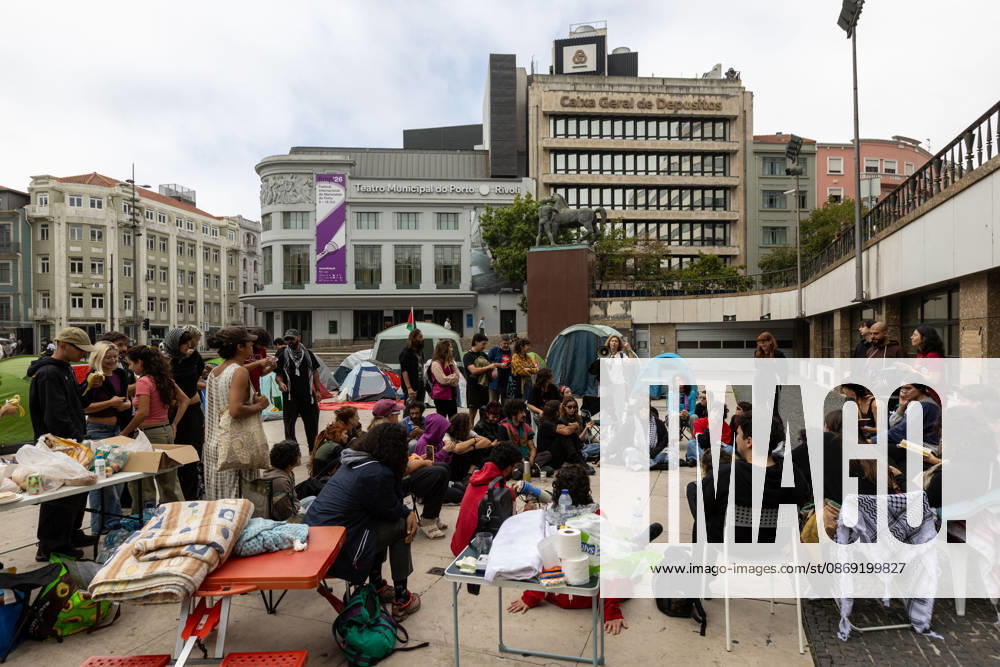 Demonstrations against housing affordability, in Porto, Portugal - 11 Oct 2026 Participants have a public assembly beside a temporary encampment in Praça D. João I during an overnight occupation organized by the Não Dá Mais Para Viver Assim movement following demonstrations against the housing crisis and rising living costs. Porto Portugal
