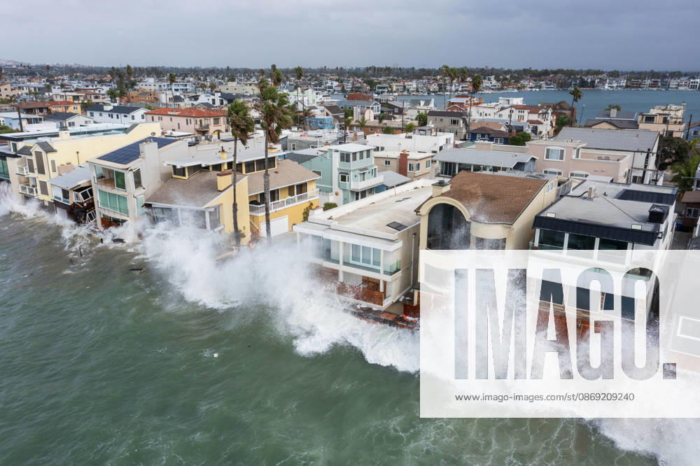 The Long Beach Peninsula is facing severe, structural devastation as Tropical Storm Rachel batters the Southern California coast. Driven by a developing El Nino pattern, this is the fourth major storm system to slam the shoreline in six weeks. Waves and unusually high tides have shattered a 30-foot section of the protective wooden bulkhead, completely shredding the historic boardwalk and allowing seawater to surge directly onto interior streets. Flooding has swamped coastal neighborhoods, forcing mandatory evacuations along oceanfront blocks like Seaside Walk. Emergency crews are working to stack thousands of sandbags and reinforce coastal defenses, but city inspectors have already been forced - ZUMAr19_ 20261011_new_r19_127