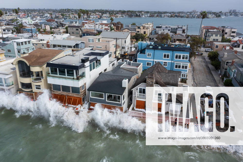 The Long Beach Peninsula is facing severe, structural devastation as Tropical Storm Rachel batters the Southern California coast. Driven by a developing El Nino pattern, this is the fourth major storm system to slam the shoreline in six weeks. Waves and unusually high tides have shattered a 30-foot section of the protective wooden bulkhead, completely shredding the historic boardwalk and allowing seawater to surge directly onto interior streets. Flooding has swamped coastal neighborhoods, forcing mandatory evacuations along oceanfront blocks like Seaside Walk. Emergency crews are working to stack thousands of sandbags and reinforce coastal defenses, but city inspectors have already been forced - ZUMAr19_ 20261011_new_r19_121