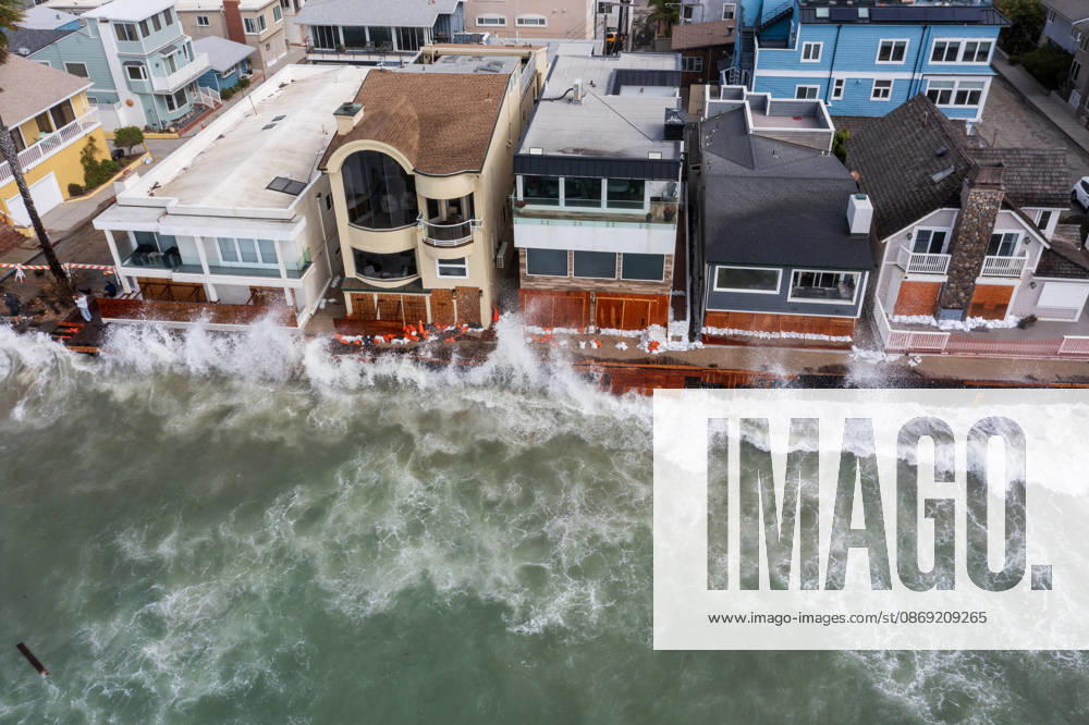 The Long Beach Peninsula is facing severe, structural devastation as Tropical Storm Rachel batters the Southern California coast. Driven by a developing El Nino pattern, this is the fourth major storm system to slam the shoreline in six weeks. Waves and unusually high tides have shattered a 30-foot section of the protective wooden bulkhead, completely shredding the historic boardwalk and allowing seawater to surge directly onto interior streets. Flooding has swamped coastal neighborhoods, forcing mandatory evacuations along oceanfront blocks like Seaside Walk. Emergency crews are working to stack thousands of sandbags and reinforce coastal defenses, but city inspectors have already been forced - ZUMAr19_ 20261011_new_r19_123