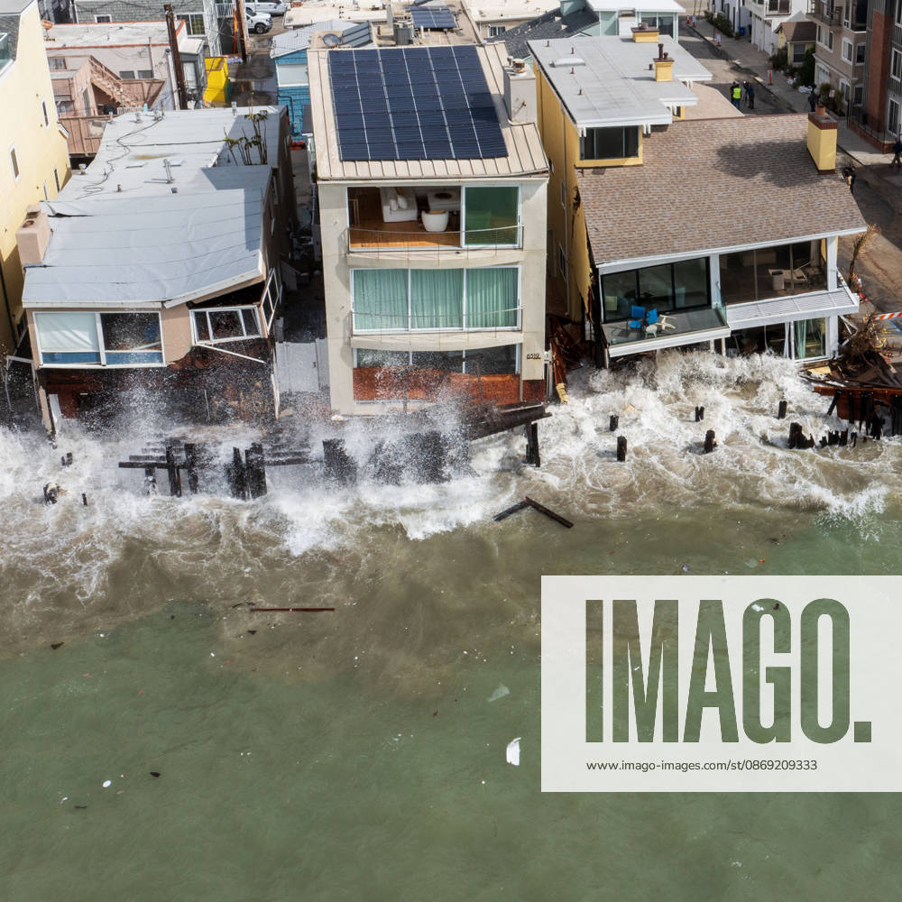 The Long Beach Peninsula is facing severe, structural devastation as Tropical Storm Rachel batters the Southern California coast. Driven by a developing El Nino pattern, this is the fourth major storm system to slam the shoreline in six weeks. Waves and unusually high tides have shattered a 30-foot section of the protective wooden bulkhead, completely shredding the historic boardwalk and allowing seawater to surge directly onto interior streets. Flooding has swamped coastal neighborhoods, forcing mandatory evacuations along oceanfront blocks like Seaside Walk. Emergency crews are working to stack thousands of sandbags and reinforce coastal defenses, but city inspectors have already been forced - ZUMAr19_ 20261011_new_r19_134