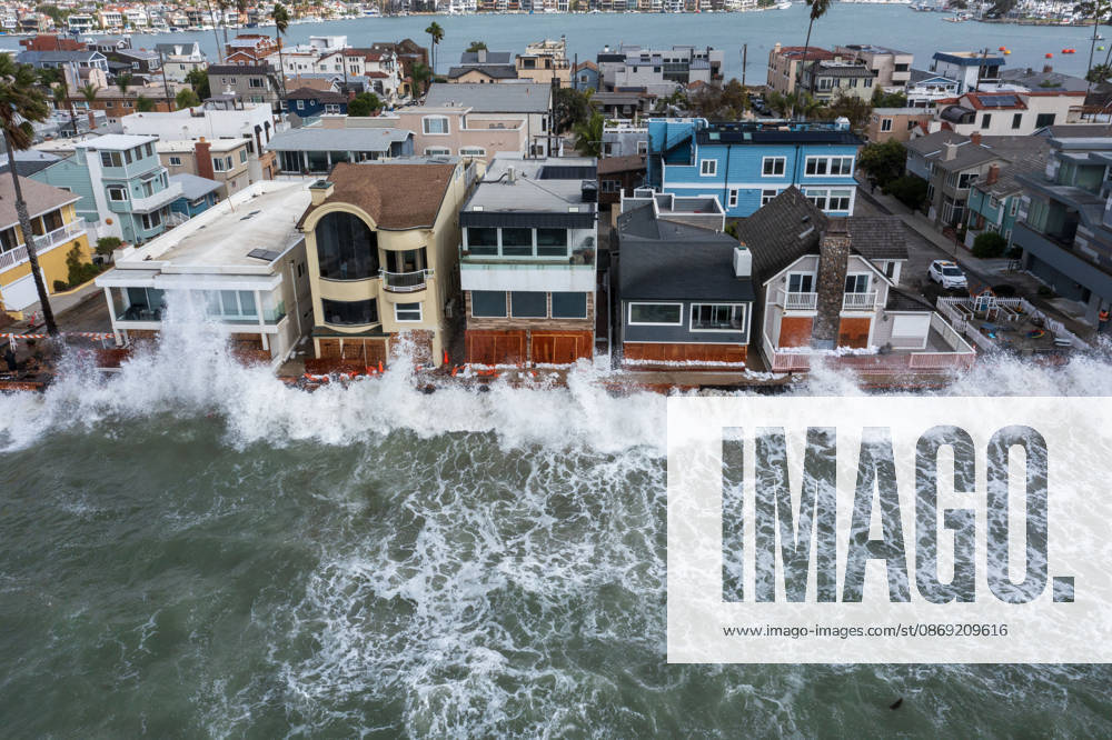 The Long Beach Peninsula is facing severe, structural devastation as Tropical Storm Rachel batters the Southern California coast. Driven by a developing El Nino pattern, this is the fourth major storm system to slam the shoreline in six weeks. Waves and unusually high tides have shattered a 30-foot section of the protective wooden bulkhead, completely shredding the historic boardwalk and allowing seawater to surge directly onto interior streets. Flooding has swamped coastal neighborhoods, forcing mandatory evacuations along oceanfront blocks like Seaside Walk. Emergency crews are working to stack thousands of sandbags and reinforce coastal defenses, but city inspectors have already been forced - ZUMAr19_ 20261011_new_r19_137